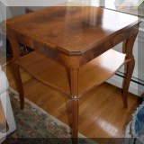 F03. Tiered side table. Some damage to top. - $95 